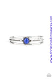 Smooth silver bars flank a textured silver band, coalescing into a layered cuff. A glowing blue cat's eye stone is pressed into the center of the cuff for a whimsical finish. Featured inside The Preview at ONE Life! Sold as one individual bracelet.  P9WH-BLXX-215XX