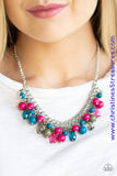 Varying in shape, glassy and polished blue, green, and pink beads swing from the bottom of interlocking silver chains. Crystal-like teardrops are sprinkled along the colorful beading, creating a flirtatious fringe below the collar. Features an adjustable clasp closure. Sold as one individual necklace. Includes one pair of matching earrings.  P2WH-MTXX-199XX
