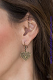 Brushed in an antiqued finish, brass filigree climbs a heart-shaped frame, creating a vintage inspired pendant below the collar. Features a toggle closure. Sold as one individual necklace. Includes one pair of matching earrings.   P2WH-BRXX-136XX