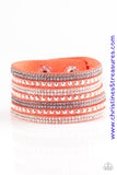 Shiny silver studs and rows of smoky and glittery white rhinestones are encrusted along strips of orange suede, creating sassy shimmer around the wrist. Features an adjustable snap closure. Sold as one individual bracelet.  P9DI-UROG-025XX