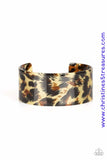 Featuring cheetah-like print, a thick acrylic cuff wraps around the wrist for a retro inspired look. Sold as one individual bracelet.  P9ST-BNXX-002XX