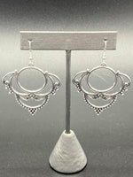 2020 July Fashion Fix Exclusive  Dotted in dainty silver studs, antiqued silver frames swirl into an ornate design for a vintage inspired look. Earring attaches to a standard fishhook fitting. Sold as one pair of earrings.  P5WH-SVXX-210XX