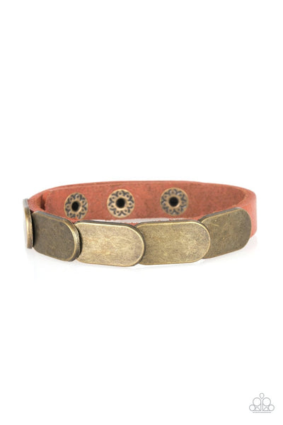 Overlapping brass frames are studded in place across a skinny brown leather band for a rugged look. Features an adjustable snap closure. Sold as one individual bracelet.  P9UR-BRXX-030XX