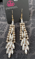 2021 April Fashion Fix Exclusive  Glassy white marquise cut rhinestones cascade from the center of a gold frame bordered in ribbons of dainty white rhinestones, creating a glamorous chandelier. Earring attaches to a standard fishhook fitting. Sold as one pair of earrings.  P5ED-GDXX-075XX