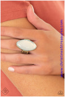 Ring: "​Opal Odyssey" (P4ST-BRXX-003AF)   Featuring a dewy iridescence, an oversized white opal bead sits atop a sleek brass frame for an ethereally rustic fashion. Features a stretchy band for a flexible fit. Sold as one individual ring.