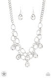 BLOCKBUSTER PIECE Joined by dainty silver links, two rows of dramatic silver chain layer below the collar in a fierce fashion. Glittery white teardrops drip from the glistening layers, adding a timeless shimmer to the show-stopping piece. Features an adjustable clasp closure. Sold as one individual necklace. Includes one pair of matching earrings.  P2RE-WTXX-178XX