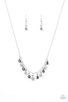 Dainty silver and white rhinestone encrusted teardrops trickle along a shimmery silver chain, creating a glamorous fringe below the collar. Features an adjustable clasp closure. Sold as one individual necklace. Includes one pair of matching earrings.  P2DA-WTXX-111XX