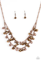 Faceted copper and coppery crystal-like beads swing from the bottoms of shimmery copper chains, creating a fierce fringe below the collar. Features an adjustable clasp closure. Sold as one individual necklace. Includes one pair of matching earrings.   P2RE-CPXX-114GL