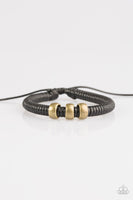 Shiny black twine wraps around a black cord, creating an urban look around the wrist. Shiny brass beads slide along the cording for a rugged finish. Features an adjustable sliding knot closure.  P9UR-BKXX-242PU