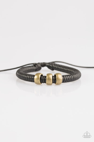 Shiny black twine wraps around a black cord, creating an urban look around the wrist. Shiny brass beads slide along the cording for a rugged finish. Features an adjustable sliding knot closure.  P9UR-BKXX-242PU
