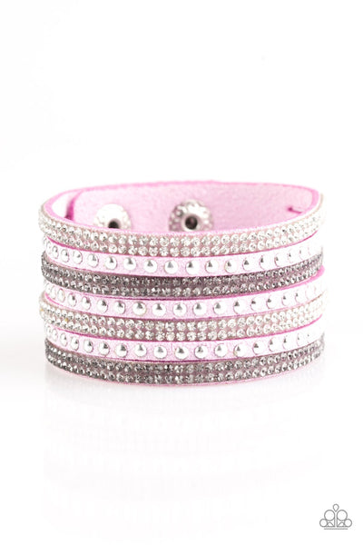 Shiny silver studs and rows of smoky and glittery white rhinestones are encrusted along strips of purple suede, creating sassy shimmer around the wrist. Features an adjustable snap closure. Sold as one individual bracelet.   P9DI-URPR-023XX