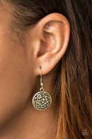 Glistening floral filigree blooms across a circular brass frame for a whimsical seasonal look. Earring attaches to a standard fishhook fitting. Sold as one pair of earrings.  P5WH-BRXX-083XX
