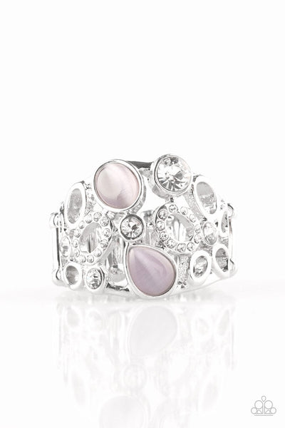 Shimmery silver frames, glassy white rhinestones, and glowing purple moonstones coalesce across the finger, creating a bubbly frame. Features a stretchy band for a flexible fit. Sold as one individual ring.  P4RE-PRXX-097XX