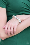 2018 October Fashion Fix - Fiercely 5th Avenue Oversized silver, crystal-like, and pearly white beads are threaded along a stretchy elastic band and wrapped around the wrist for a glamorous look. White rhinestone encrusted rings are sprinkled between the dramatic beads for a sparkling finish. Sold as one individual bracelet. Get The Complete Look! Necklace: "The Camera Never Lies - White" (Sold Separately) Ring: "Pampered In Pearls - White" (Sold Separately) P9RE-WTXX-266HF