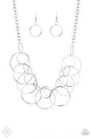 April 2019 Fashion Fix Textured silver links connect to a collection of glistening silver hoops below the collar, creating a statement-making fringe. Features an adjustable clasp closure. Sold as one individual necklace. Includes one pair of matching earrings.  P2ST-SVXX-052MB