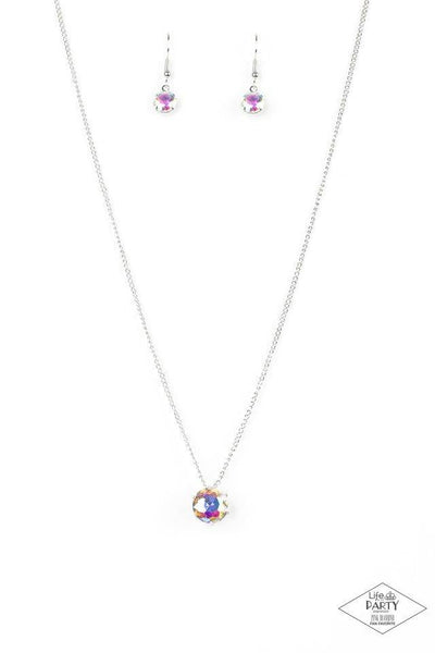 A single iridescent rhinestone sparkles brilliantly at the bottom of a dainty silver chain, creating a stunning solitaire design. Features an adjustable clasp closure. Sold as one individual necklace. Includes one pair of matching earrings.  This Fan Favorite is back in the spotlight at the request of our 2020 Life of the Party member with Black Diamond Access, Michelle E.  P2DA-MTXX-053XX
