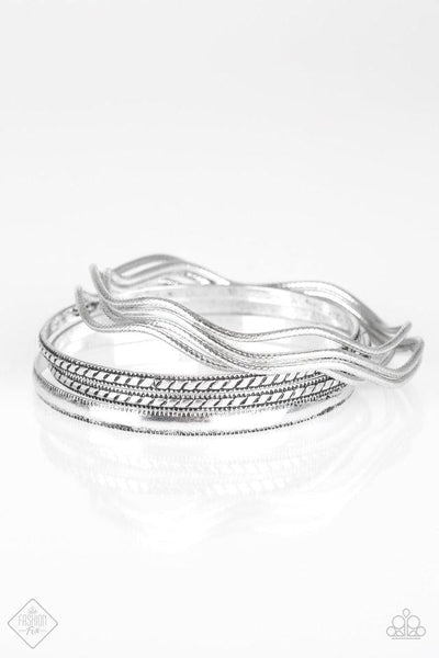 2018 October Fashion Fix - Simply Santa Fe  Stamped in tribal inspired patterns, round and wavy silver bangles stack across the wrist for a seasonal look. Sold as one set of seven bracelets.  P9BA-SVXX-021HD