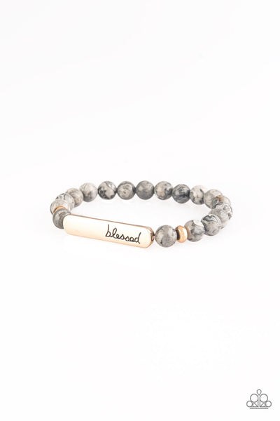 Infused with dainty gold accents, a collection of colorful natural stones are threaded along a stretchy band. A glistening gold frame engraved with the word, "blessed" adorns the center for a seasonal finish. Sold as one individual bracelet. P9SE-URGD-031XX