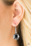 Featuring a regal emerald style cut, a glittery black gem is pressed into a shimmery silver frame radiating with glassy white rhinestones for a refined look. Earring attaches to a standard fishhook fitting. Sold as one pair of earrings.  P5DA-BKXX-052XX