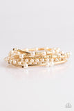 Pearly white beads and gold accents are threaded along elastic stretchy bands, creating refined layers across the wrist. Sold as one set of six bracelets.  P9RE-GDXX-119XX