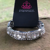 2020 October Fashion Fix Exclusive Rhinestone encrusted silver bars flank a dazzling trio of oversized white rhinestones, coalescing into a glittery frame. The sparkly frames are threaded along stretchy bands around the wrist, creating an irresistible shimmer. Sold as one individual bracelet. P9RE-WTXX-392XX