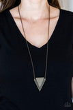 Stamped and studded in indigenous inspired textures, a stacked triangular pendant swings from the bottom of an elongated brass chain for a trendy tribal look. Features an adjustable clasp closure. Sold as one individual necklace. Includes one pair of matching earrings. P2ED-BRXX-074XX