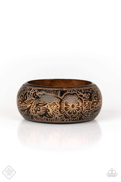2019 March Fashion Fix - Sunset Sightings A thick wooden bangle is etched in intricate floral patterns, creating an irresistibly laid-back statement piece. Sold as one individual bracelet. P9SE-BNXX-113MA