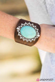 2019 BLACK DIAMOND LIFE OF THE PARTY BRING BACK PIECE Brushed in a distressed finish, a thick band of leather wraps around the wrist. An oversized turquoise stone is pressed into the center of a regal silver frame, creating a dramatic centerpiece. Features an adjustable snap closure. P9UR-BNXX-159XX