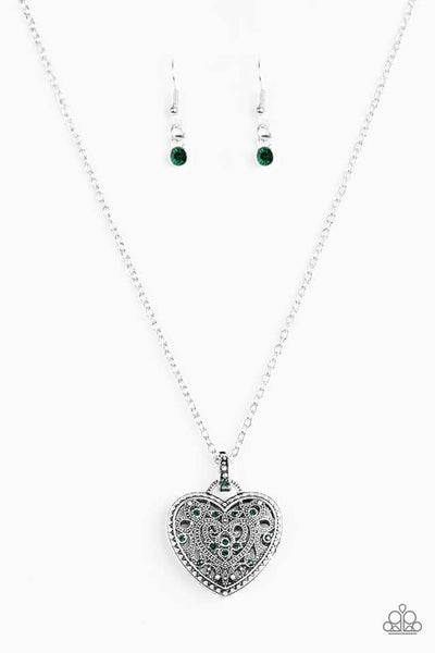 Encrusted in glittery green rhinestones, a vintage inspired heart pendant swings from the bottom of a shimmery silver chain for a romantic fashion. Features an adjustable clasp closure. Sold as one individual necklace. Includes one pair of matching earrings. P2WH-GRXX-222XX