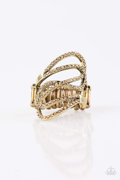 Encrusted in golden topaz rhinestones, sparkling brass ribbons swoop across the finger for a refined look. Features a stretchy band for a flexible fit. Sold as one individual ring.  P4RE-BRXX-097XX