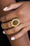Golden topaz rhinestones spin around a glowing brown moonstone center, creating a whimsical floral frame atop the finger. Features a stretchy band for a flexible fit. Sold as one individual ring.  P4RE-BRXX-108XX