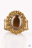 Golden topaz rhinestones spin around a glowing brown moonstone center, creating a whimsical floral frame atop the finger. Features a stretchy band for a flexible fit. Sold as one individual ring.  P4RE-BRXX-108XX