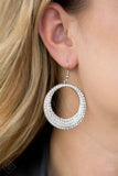 2018 November Fashion Fix - Fiercely 5th Avenue A circular silver frame is encrusted in row after row of glassy white rhinestones. The bottom edge of the frame is slightly thicker than the top, giving way to an added blast of dramatically blinding shimmer. Earring attaches tow a standard fishhook fitting. Sold as one pair of earrings. P5RE-WTXX-366HL
