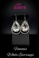 2019 November Life Of The Party Exclusive A dramatically oversized white teardrop gem is pressed into a doubled silver frame encrusted in countless white rhinestones for a blinding look. Earring attaches to a standard fishhook fitting. Sold as one pair of earrings. P5RE-WTXX-429XX