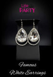 2019 November Life Of The Party Exclusive A dramatically oversized white teardrop gem is pressed into a doubled silver frame encrusted in countless white rhinestones for a blinding look. Earring attaches to a standard fishhook fitting. Sold as one pair of earrings. P5RE-WTXX-429XX