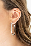 2019 June Life Of The Party Exclusive The front half and inner backside of a sleek silver hoop is encrusted in glassy white rhinestones, easily catching and reflecting the light for an extra dash of shimmer. Earring attaches to a standard post fitting. Hoop measures approximately 2" in diameter. Sold as one pair of hoop earrings. P5HO-WTXX-077XX