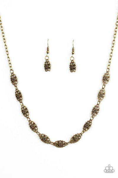 Brushed in an antiqued shimmer, dainty floral charms link below the collar for a seasonal look. Features an adjustable clasp closure. Sold as one individual necklace. Includes one pair of matching earrings.  Get The Complete Look! Bracelet: "Easy Daisy - Brass" (Sold Separately)  P2WH-BRXX-122WB