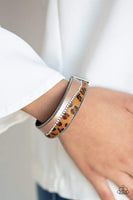 2019 October Life Of The Party Infused with strands of antiqued silver chains and glassy white rhinestones, wavy pieces of tan leather and cheetah print line the front of a black suede band for a fierce look. Features an adjustable clasp closure. Sold as one individual bracelet.  P9DI-URBN-092XX