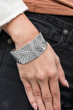 Bracelet: "Geo Guru" (P9TR-SVXX-086RJ)  Delicately hammered and embossed in a collision of patterns and textures, a thick silver cuff wraps around the wrist for a bold tribal look. Sold as one individual bracelet.