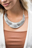 Necklace: "Geographic Goddess" (P2ST-SVXX-100RJ)  An array of silver plates that have been hammered in texture and decorated in adventurous patterns connect below the collar to create the illusion of a single curved bar that sits boldly along the collar. Features an adjustable clasp closure. Sold as one individual necklace. Includes one pair of matching earrings.