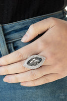 Featuring a smoky finish, a dramatic gem is pressed into the center of stacking silver frames encrusted in row after row of glassy white rhinestones for a blinding look. Features a stretchy band for a flexible fit. Sold as one individual ring.  P4RE-SVXX-153XX