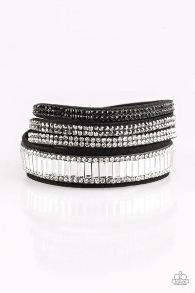 Encrusted in mismatched sparkle, half of a black suede band is encrusted in white emerald style cut rhinestones, while the other half splits into three separate bands encrusted in white, hematite, and black rhinestones for a sassy look. The elongated band allows for a trendy double wrap design. Features an adjustable snap closure. Sold as one individual bracelet.  P9DI-URMT-005XX
