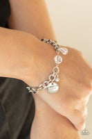 Iridescent crystal-like beads, a dainty white rhinestone, and a silver disc stamped in the word, "love," adorn a double-linked silver chain, creating a flirty fringe around the wrist. Features an adjustable clasp closure. Sold as one individual bracelet. P9RE-WTXX-420XX