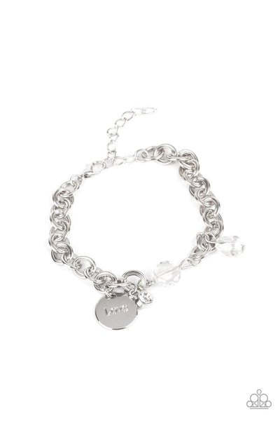 Iridescent crystal-like beads, a dainty white rhinestone, and a silver disc stamped in the word, "love," adorn a double-linked silver chain, creating a flirty fringe around the wrist. Features an adjustable clasp closure. Sold as one individual bracelet. P9RE-WTXX-420XX