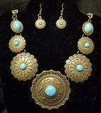 Radiating with tribal inspired textures, round brass frames link below the collar in a seasonal fashion. Refreshing turquoise stones are pressed into the ornate centers for a seasonal finish. Features an adjustable clasp closure. Sold as one individual necklace. Includes one pair of matching earrings.  **** Please note the necklace on hand is not shiny brass but more antiqued and darker brass ****  P2TR-BRBL-069XX