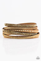 Strands of glistening brass studs, glittery aurum rhinestones, and brown suede dusted in glitter wrap around the wrist, creating mismatched shimmer. The elongated band allows for a trendy double wrap design. Features an adjustable snap closure. Sold as one individual bracelet.  P9DI-URBR-007XX