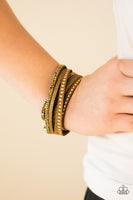 Strands of glistening brass studs, glittery aurum rhinestones, and brown suede dusted in glitter wrap around the wrist, creating mismatched shimmer. The elongated band allows for a trendy double wrap design. Features an adjustable snap closure. Sold as one individual bracelet.  P9DI-URBR-007XX