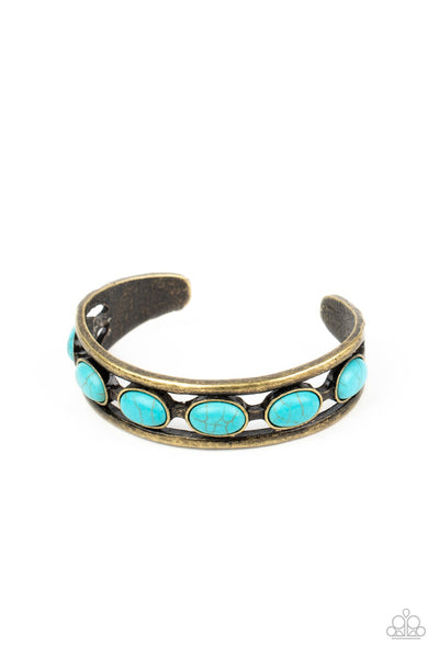 A refreshing collection of oval turquoise stones are studded across the airy center of a layered brass cuff for a rustic flair. Sold as one individual bracelet. P9SE-BRXX-061XX