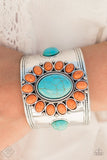 Vivacious orange stones spin around a refreshing turquoise stone center, creating a whimsical flower atop the wrist. Round turquoise stones flank the floral center, adding a handcrafted finish to the thick silver cuff that has been polished to perfection.  Sold as one individual bracelet.