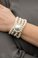 Bracelet: "Top Tier Twinkle" (P9RE-WTXX-369TO) Threaded along stretchy bands, four strands of pearly white beads are held in place by an exaggerated pearl bead encased in a frame of glassy white rhinestones for a vintage-inspired finish. Sold as one individual bracelet.